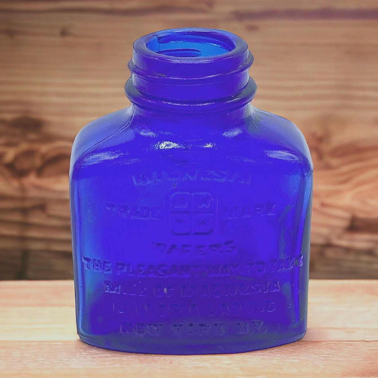 Vtg Milnesia Wafers Embossed Cobalt Blue Glass Bottle 3″ Tall New York, NY