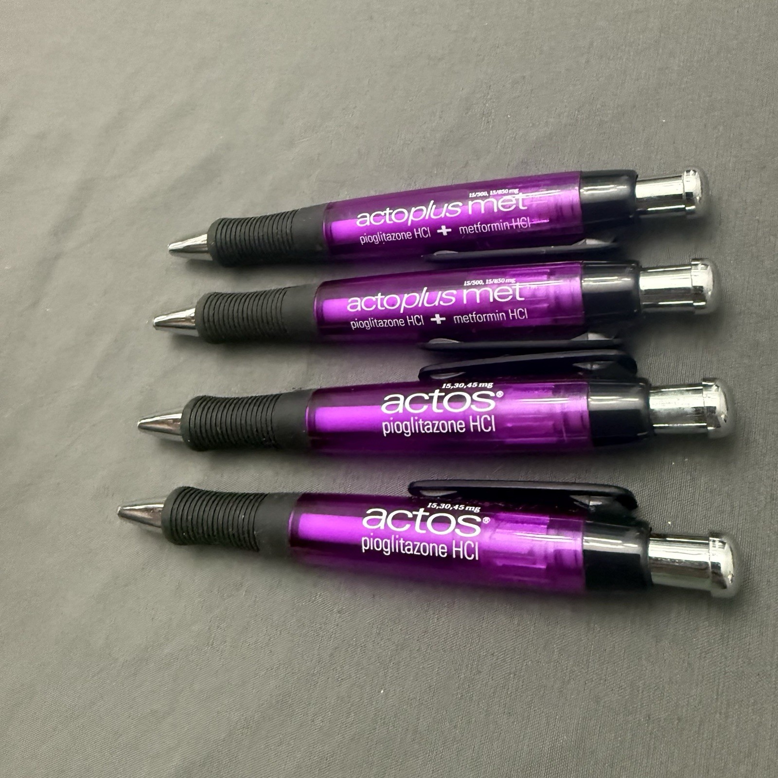 Lot of 4 Purple Pharmaceutical Promo Pens Actos Actoplus Met Rubber Grip Click