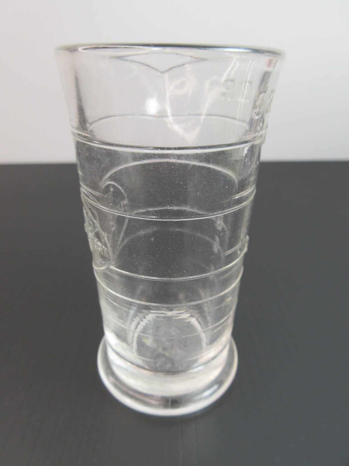 1930’s ENSIGN UK Footed Glass Embossed APOTHECARY MEASURE BEAKER Ounces & Drams