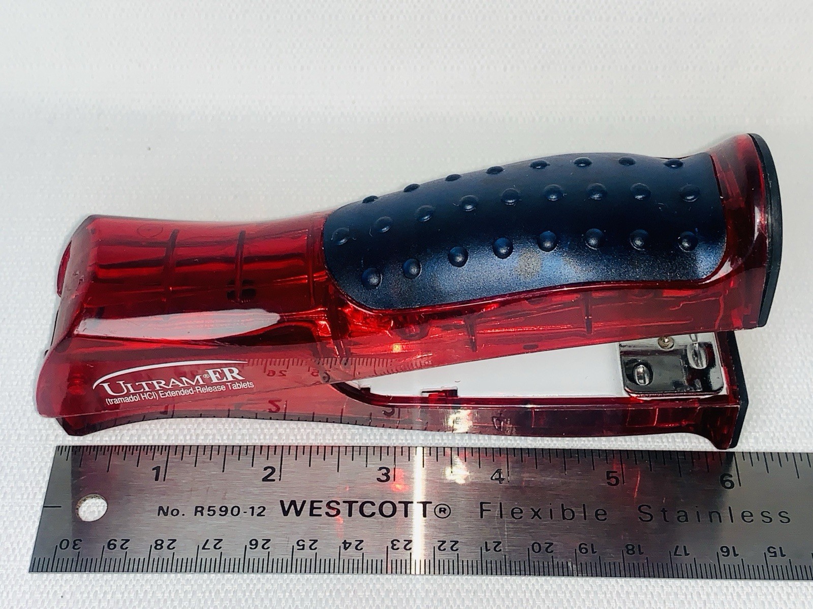 Ultram ER Drug Rep Promo Stapler – Red Translucent Stand-Up Ergonomic Squeeze