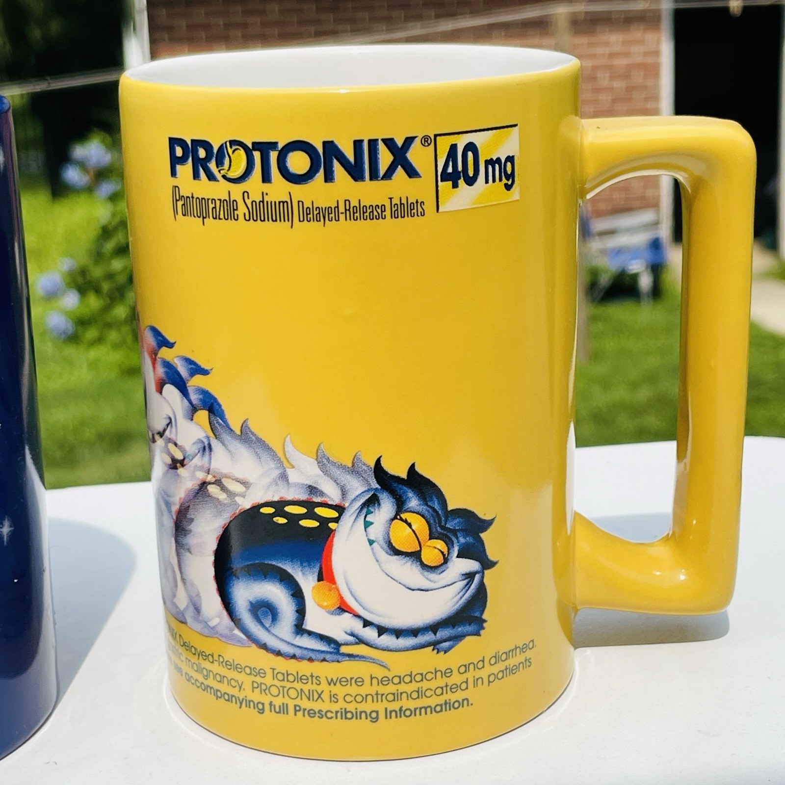 Lot Of 2 Protonix Coffee Mugs Heartburn Monster Pharmaceutical Advertisement