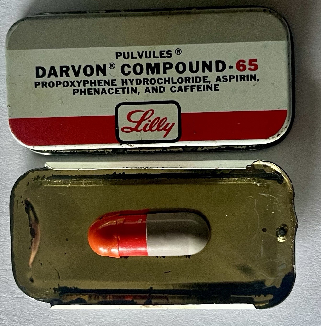 Lilly Pharmaceutical Darvon-65 Compound Pulvule Sample Tin with 1 Pulvule Inside