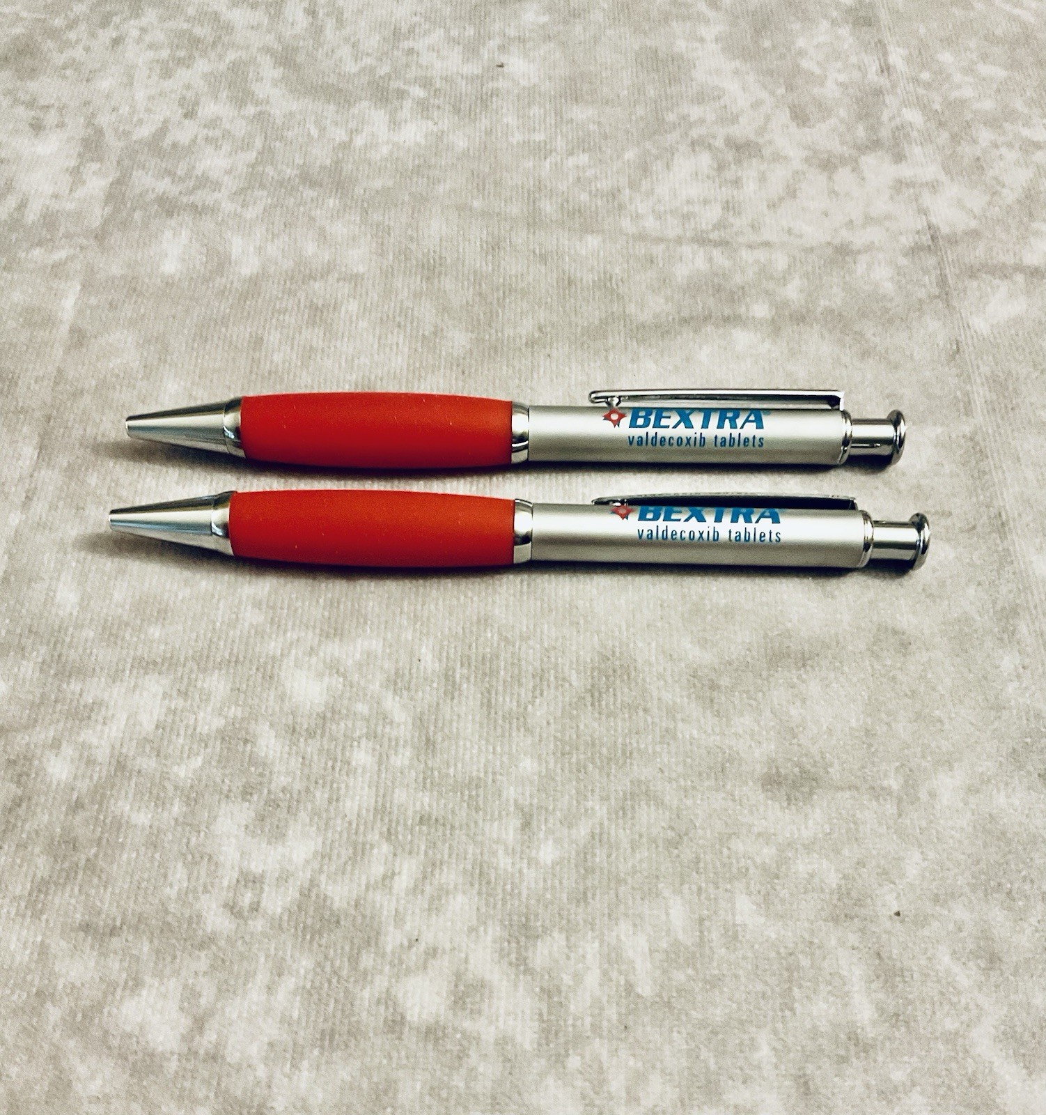 BEXTRA PHARMACEUTICAL REP PEN METAL RETRACTABLE REFILLABLE RED GRIP LOT OF 2
