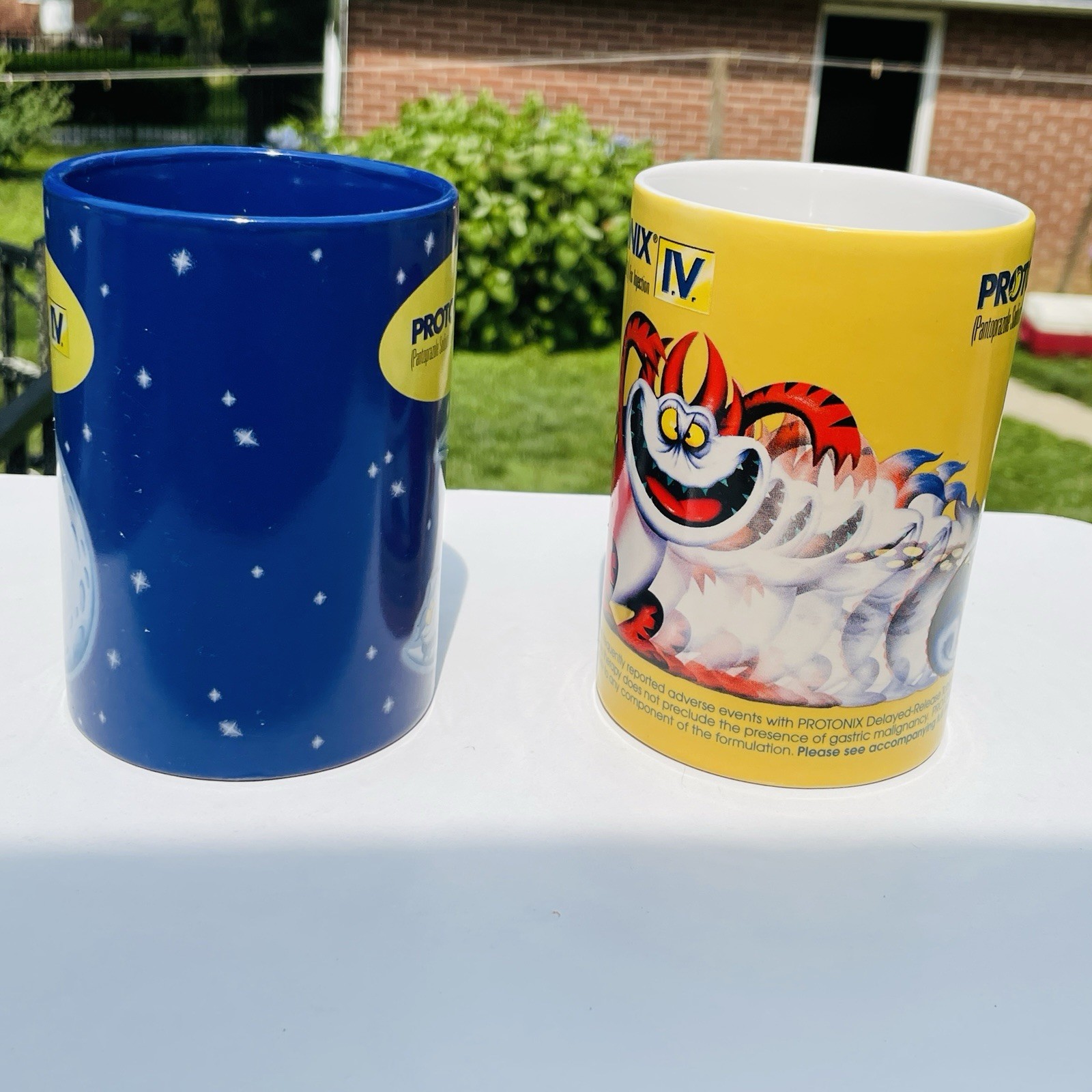 Lot Of 2 Protonix Coffee Mugs Heartburn Monster Pharmaceutical Advertisement