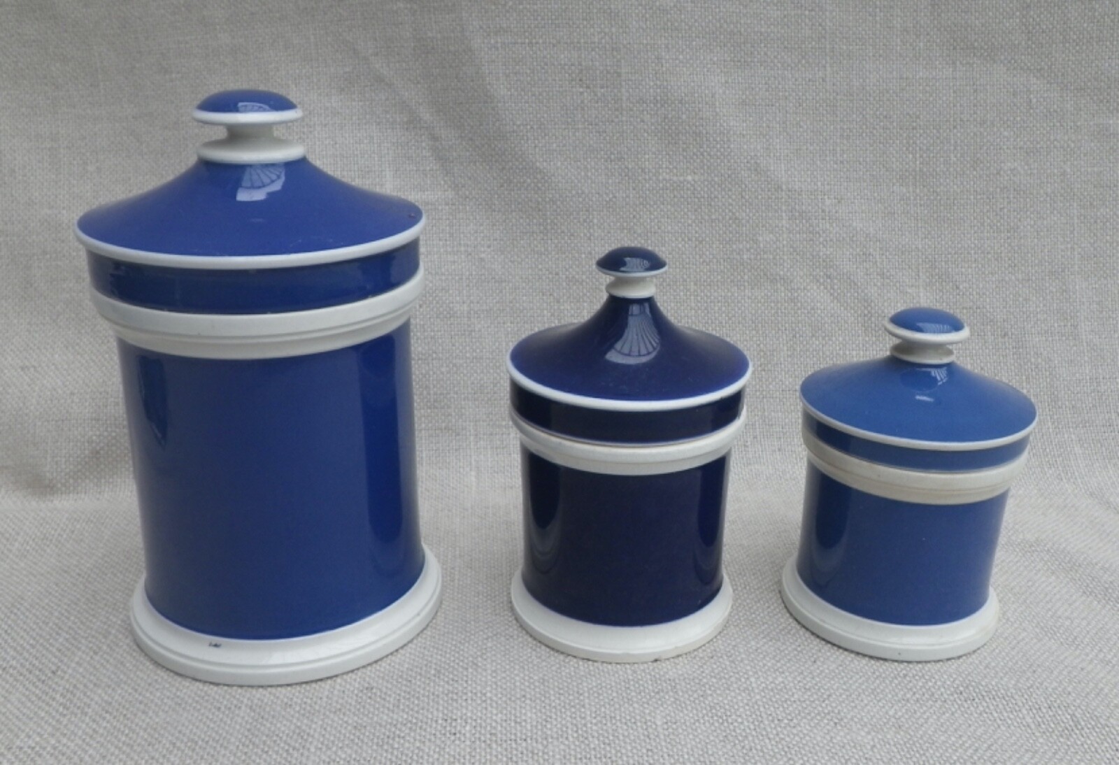 Collection of Small Blue Slip-Decorated Ceramic Apothecary Jars with Lids