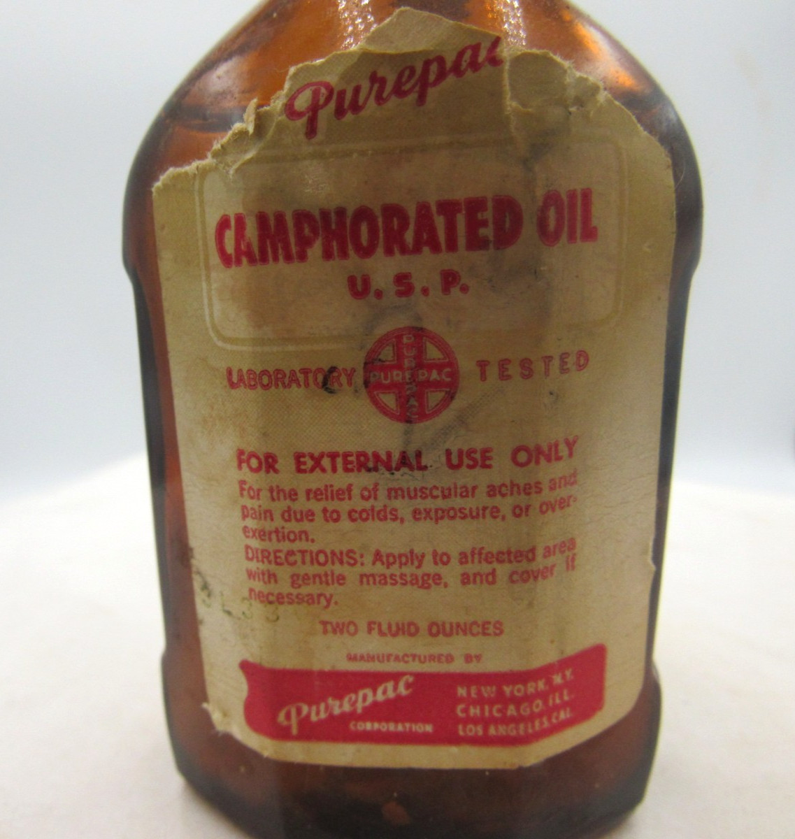 1940’s Purepac Caphorated Oil New York 3 5/8 inch tall Amber Medicine Bottle