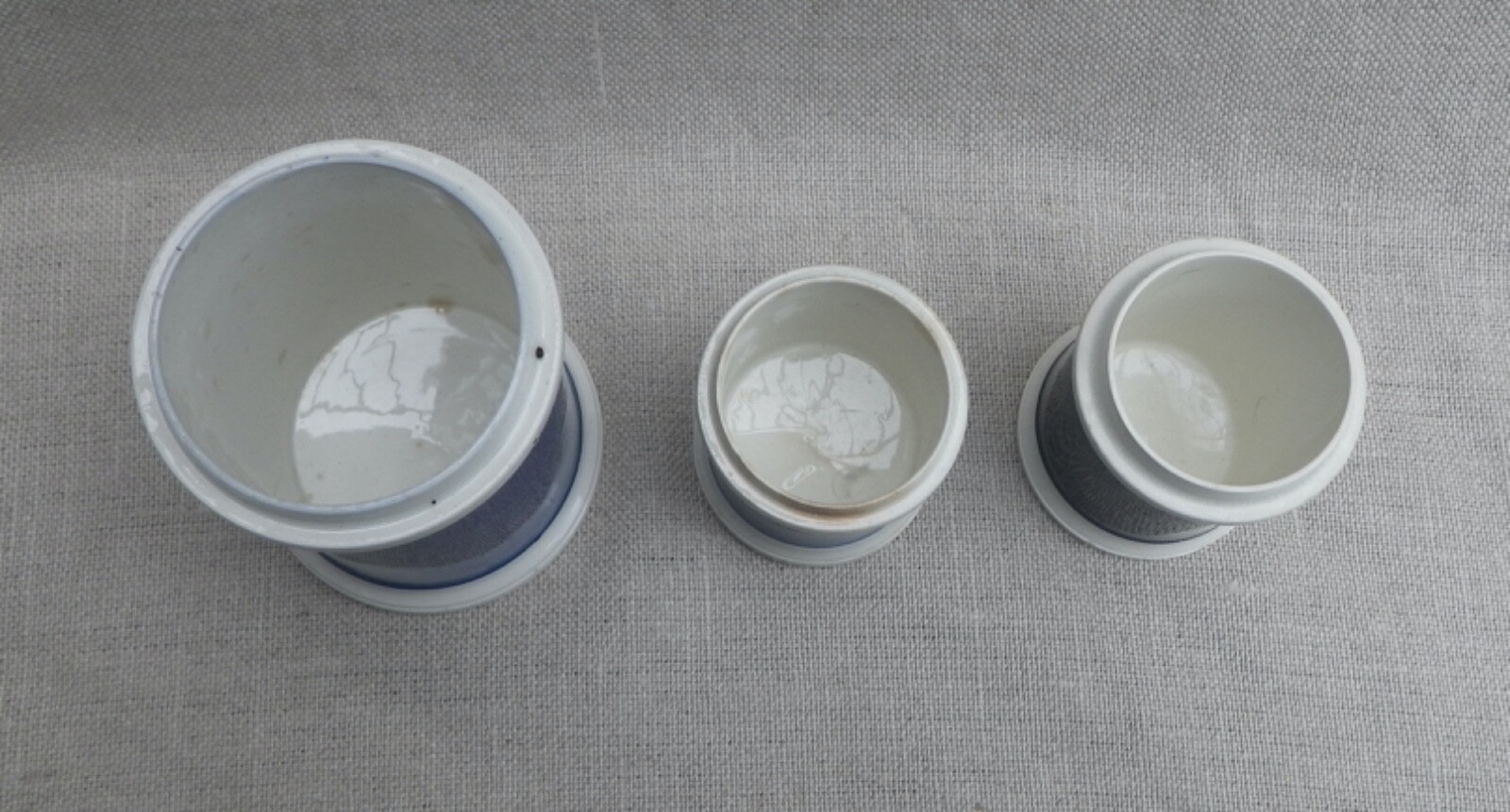 Collection of Small Blue Slip-Decorated Ceramic Apothecary Jars with Lids