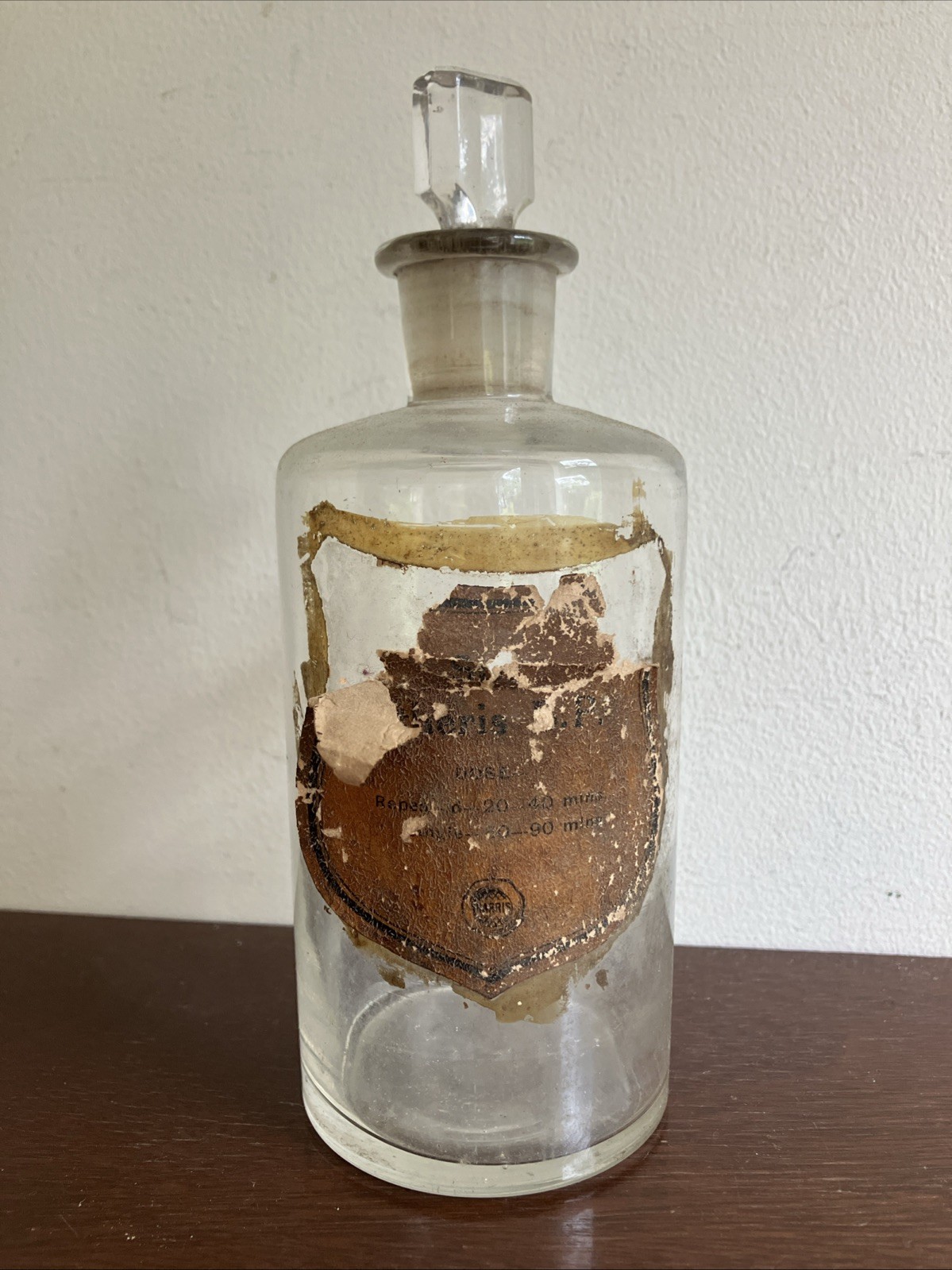 Antique Glass Apothecary Bottle With Tatty Shield Shaped Label, Glass Stopper