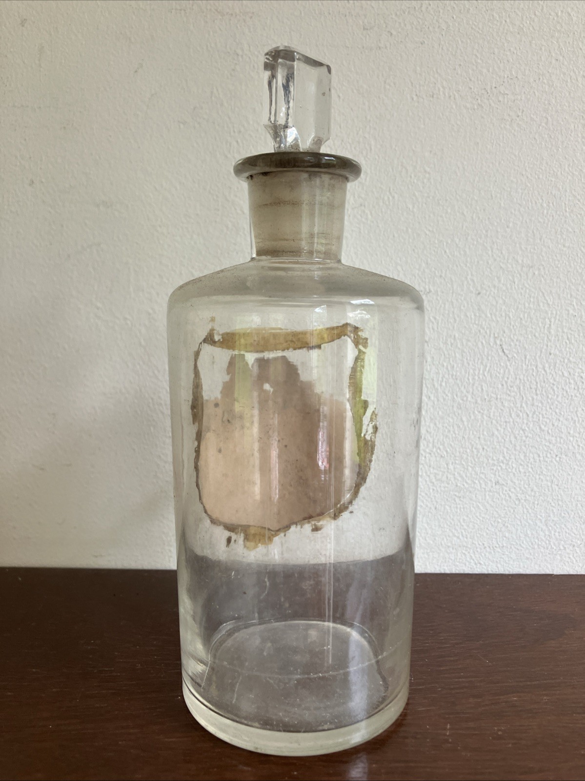 Antique Glass Apothecary Bottle With Tatty Shield Shaped Label, Glass Stopper