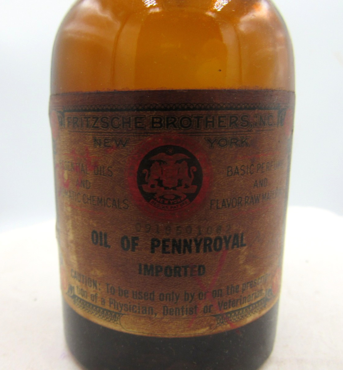 MM – 1940’s Fritzsche Bros NY Oil of Pennyroyal 4 1/2″ Amber Medicine bottle