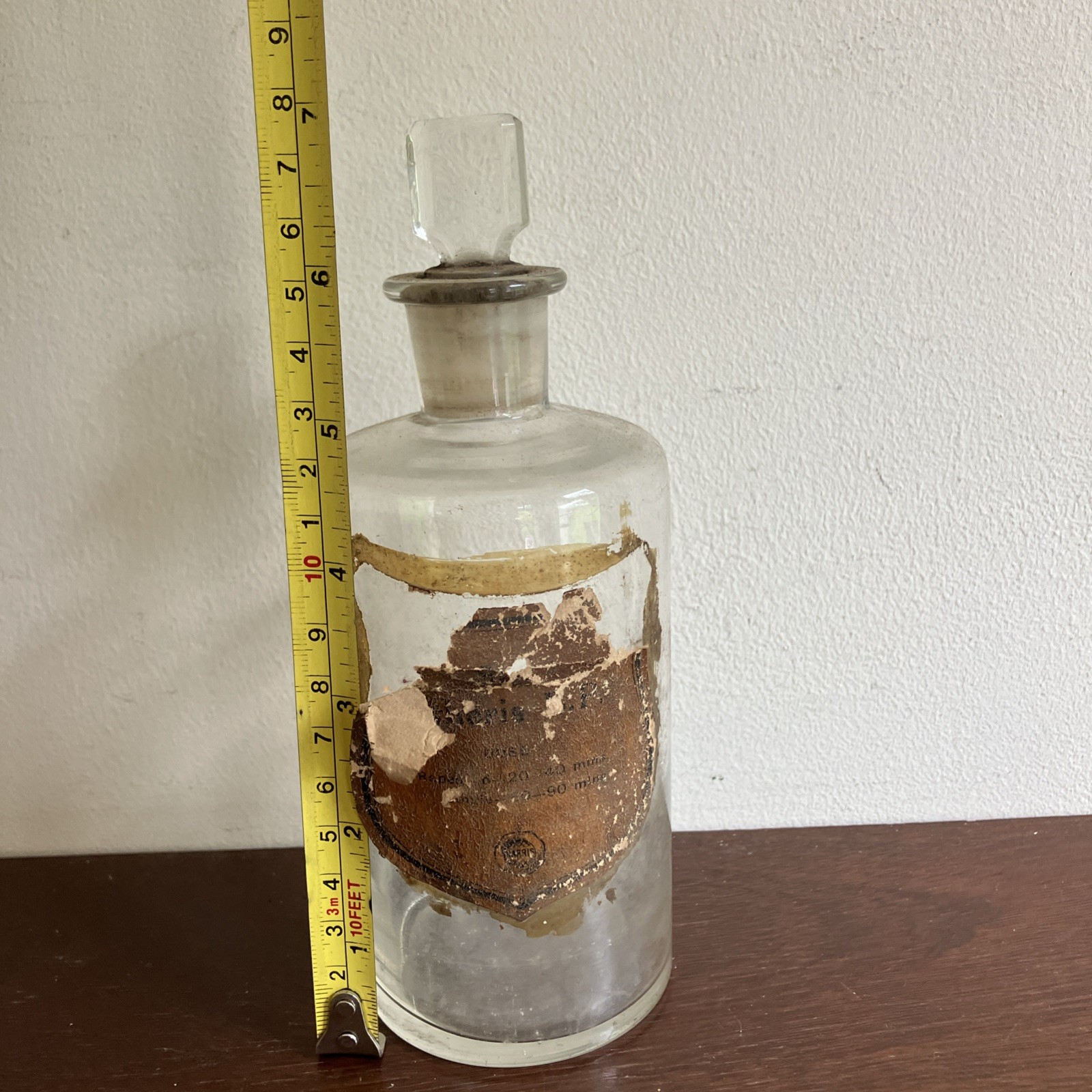 Antique Glass Apothecary Bottle With Tatty Shield Shaped Label, Glass Stopper