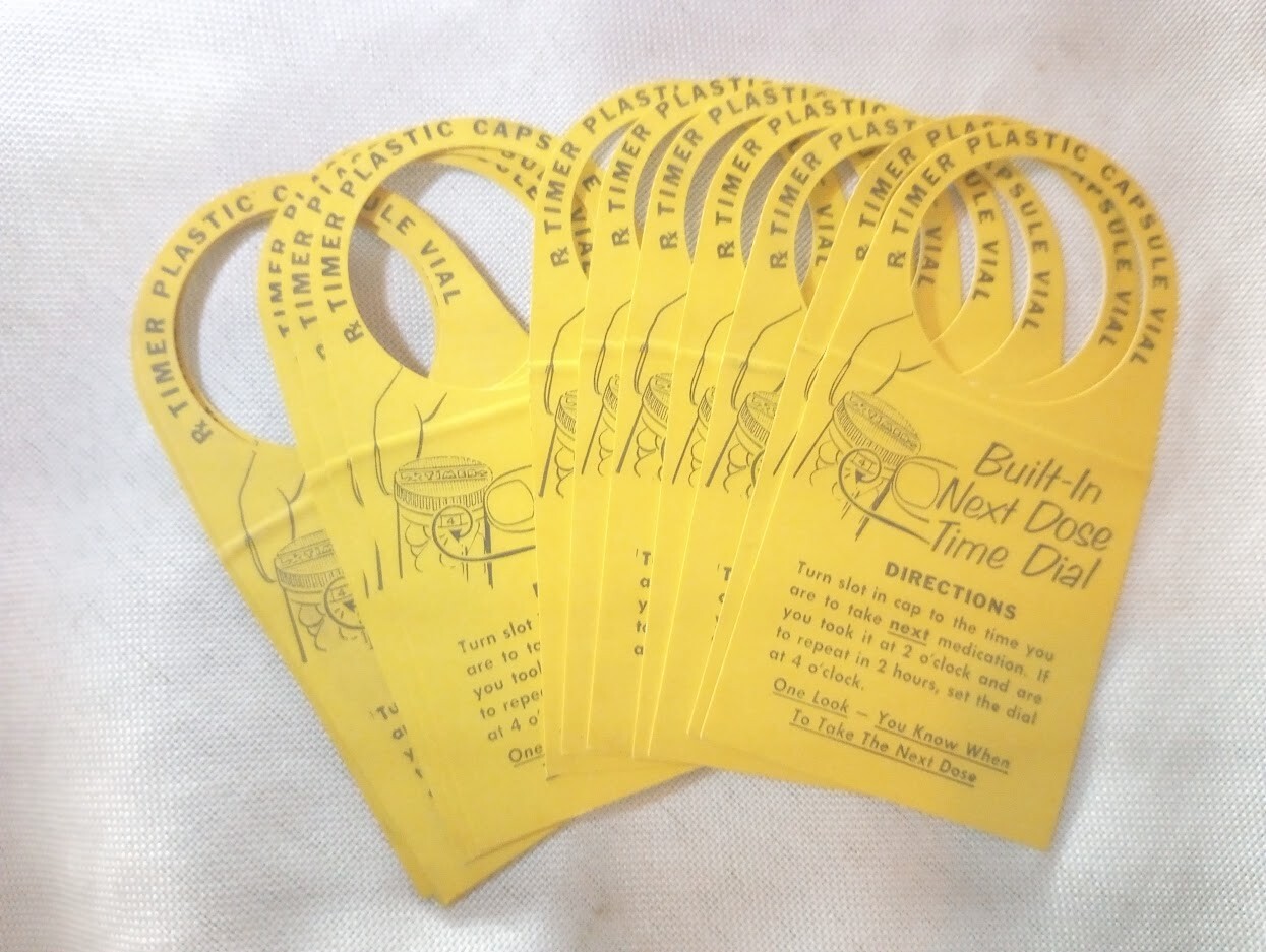 13 vintage “Time Plastic Capsule Vial” prescription dose drug store labels