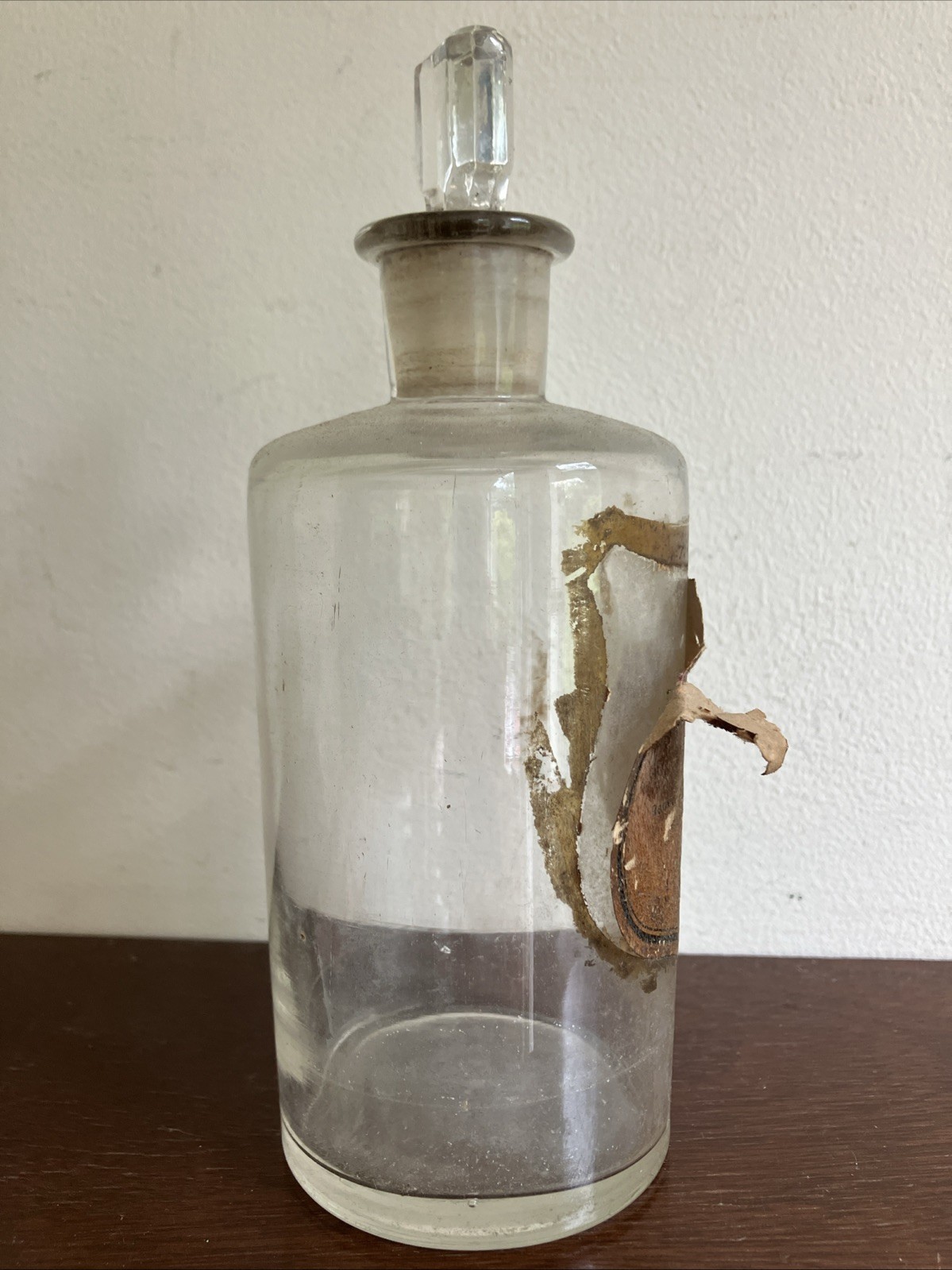 Antique Glass Apothecary Bottle With Tatty Shield Shaped Label, Glass Stopper