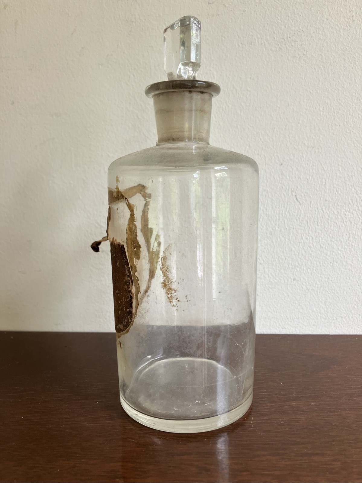 Antique Glass Apothecary Bottle With Tatty Shield Shaped Label, Glass Stopper