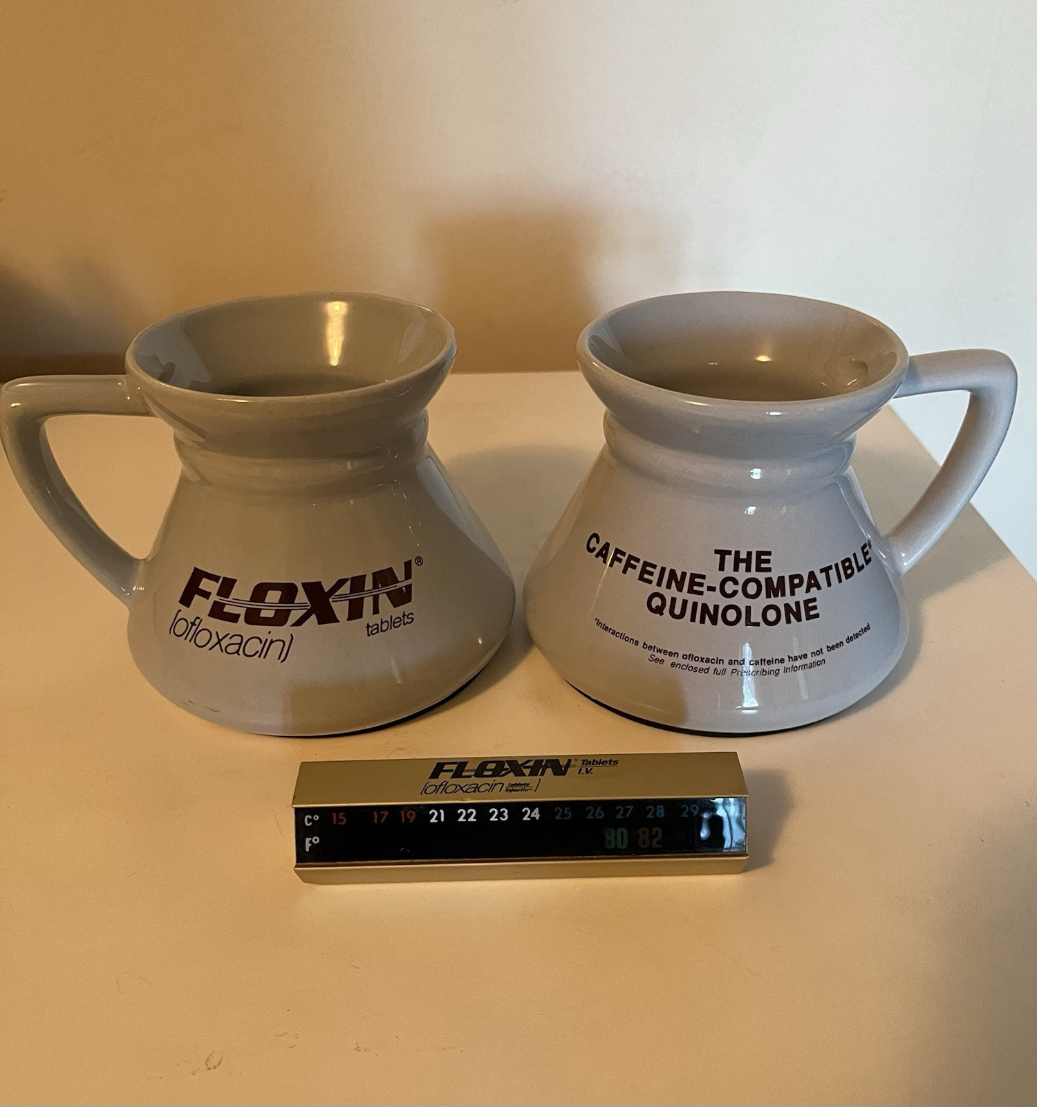 Drug rep Floxin 2 ceramic mugs, paperweight thermometer, canvas laptop bag