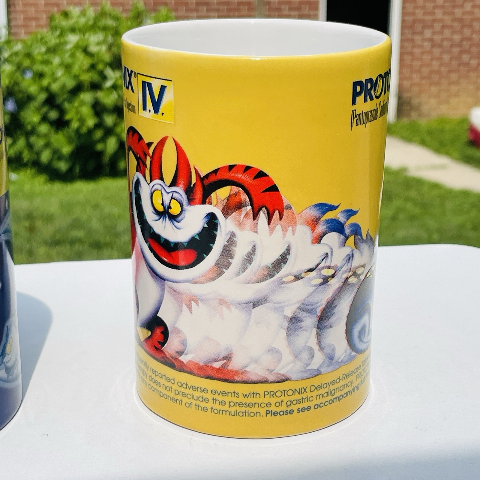 Lot Of 2 Protonix Coffee Mugs Heartburn Monster Pharmaceutical Advertisement