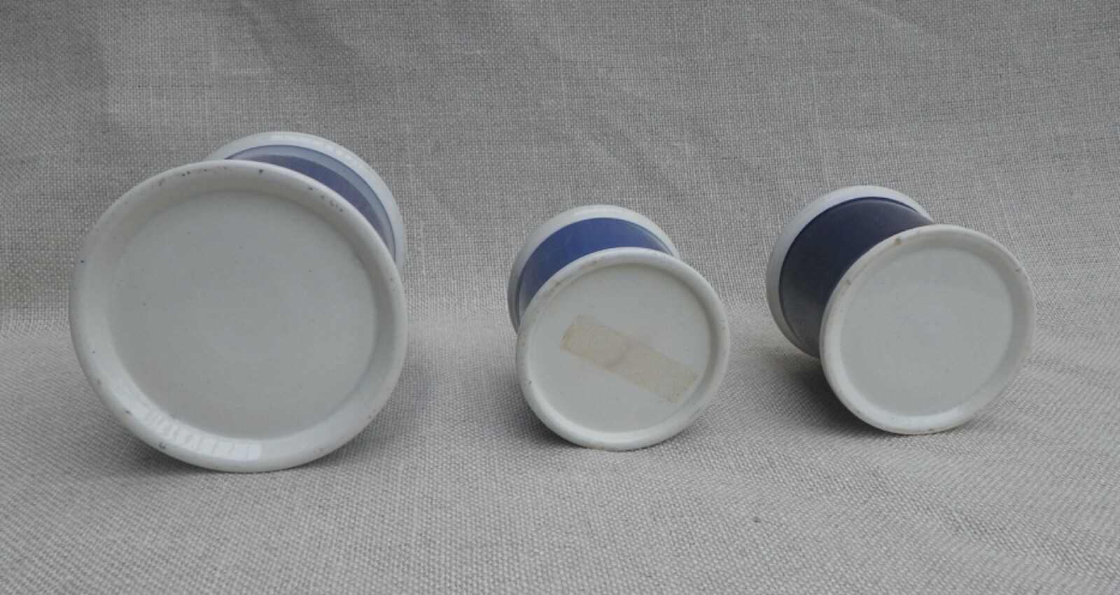 Collection of Small Blue Slip-Decorated Ceramic Apothecary Jars with Lids