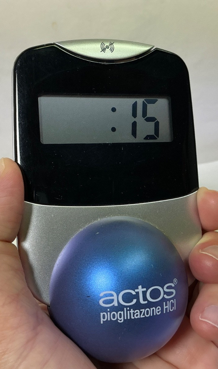 Actos Pharmaceutical Drug Rep Clock Balances On Ball, Works