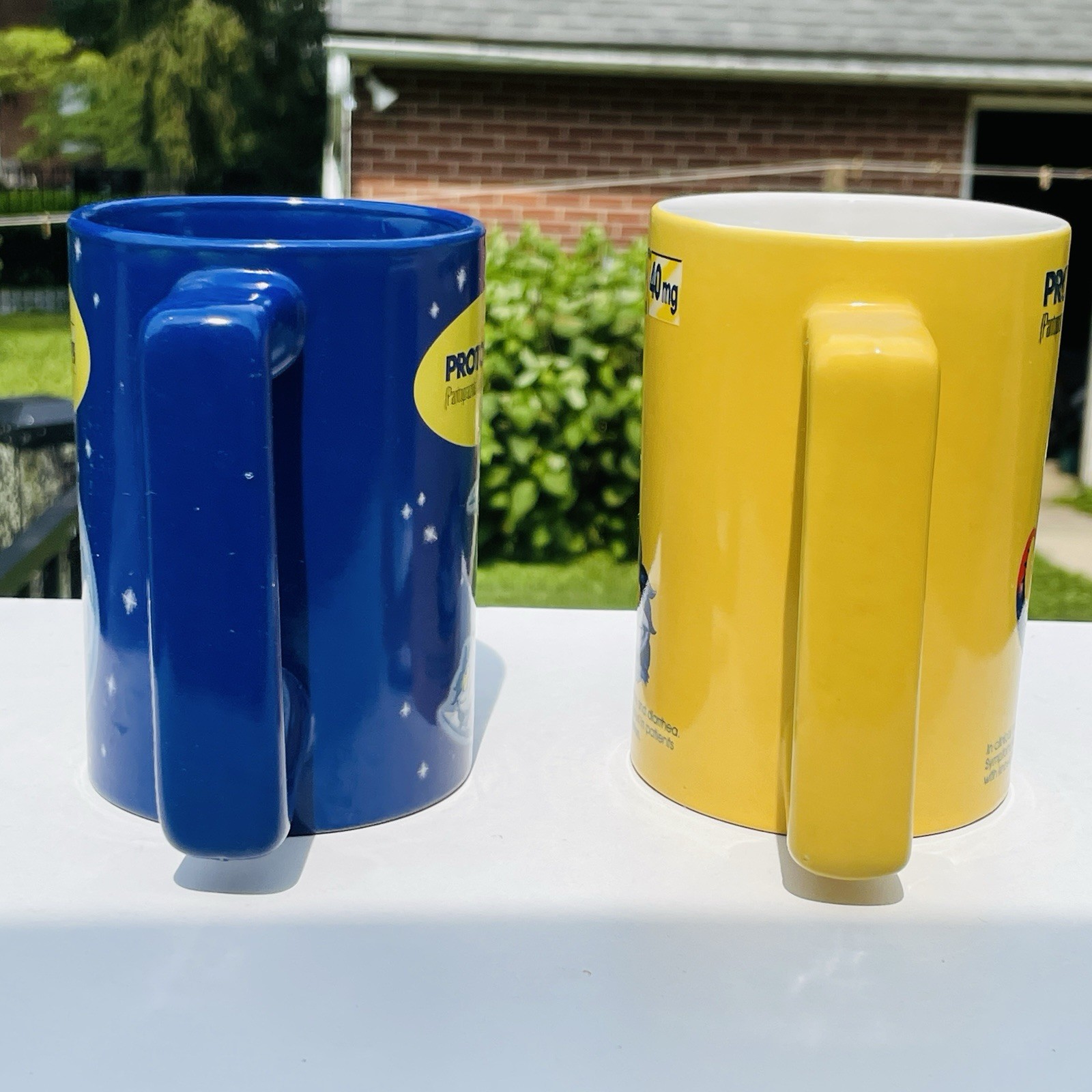 Lot Of 2 Protonix Coffee Mugs Heartburn Monster Pharmaceutical Advertisement